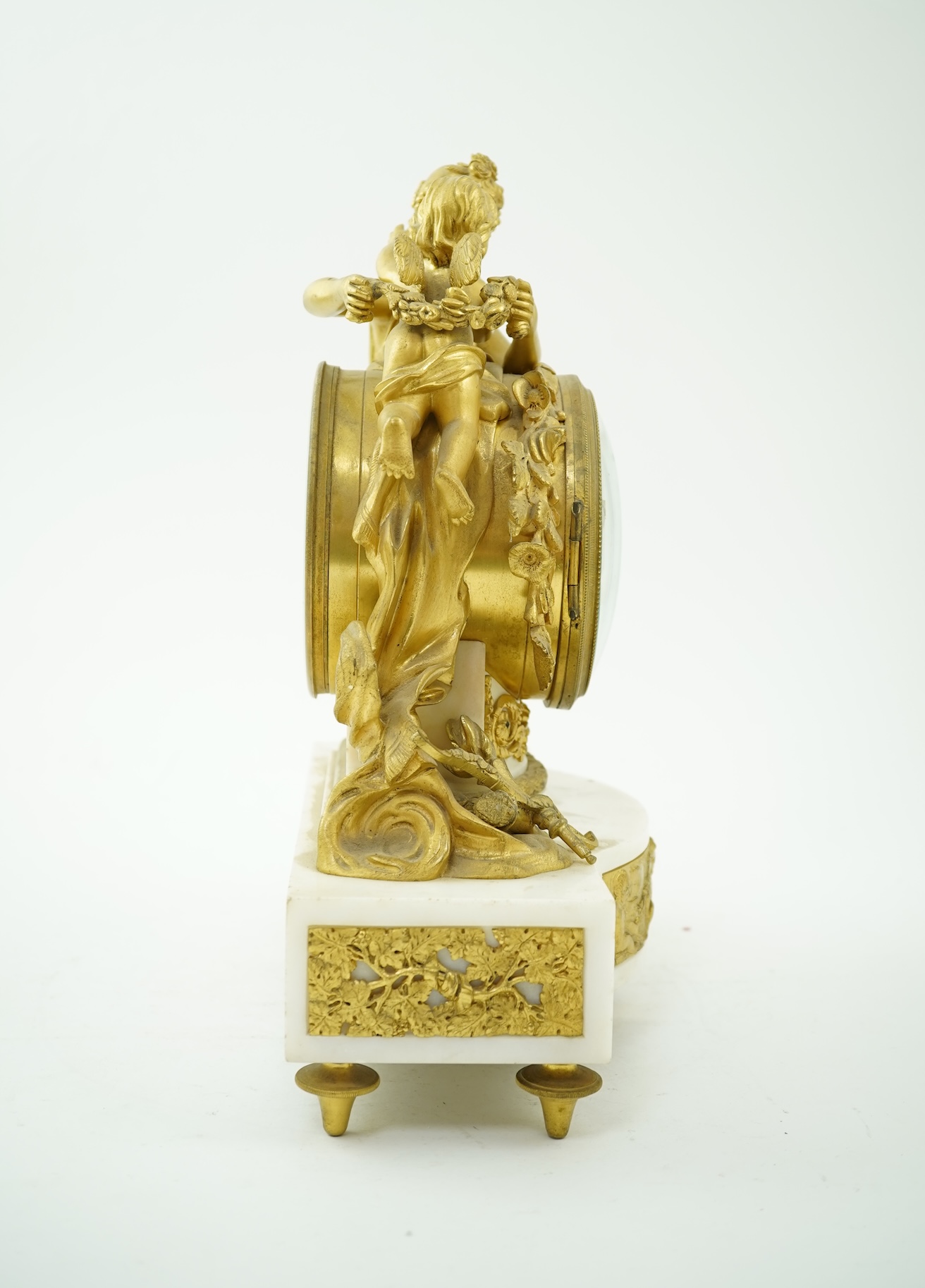 An early 19th century French figural ormolu and white marble mantel clock